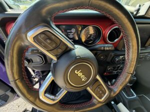 Jeep steering wheel and dashboard illustrating common steering wheel shaking and vibration problems.