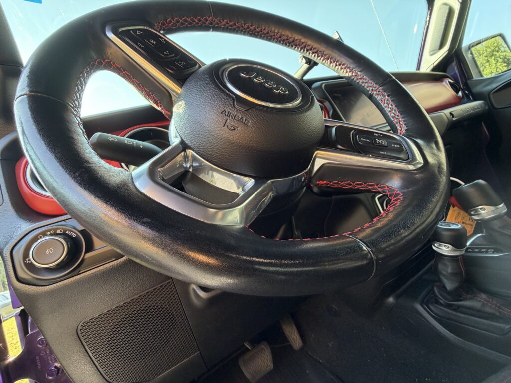 Close-up of a Jeep steering wheel used to illustrate steering wheel vibration and suspension problems.