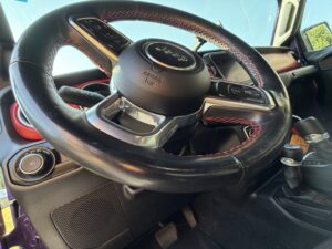 Close-up of a Jeep steering wheel used to illustrate steering wheel vibration and suspension problems.